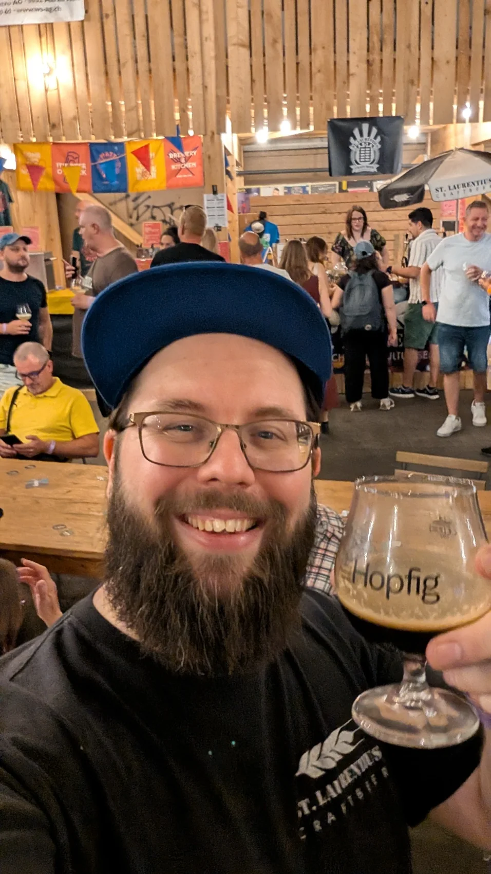 Sandro at Hopfig festival holding a tasting glass